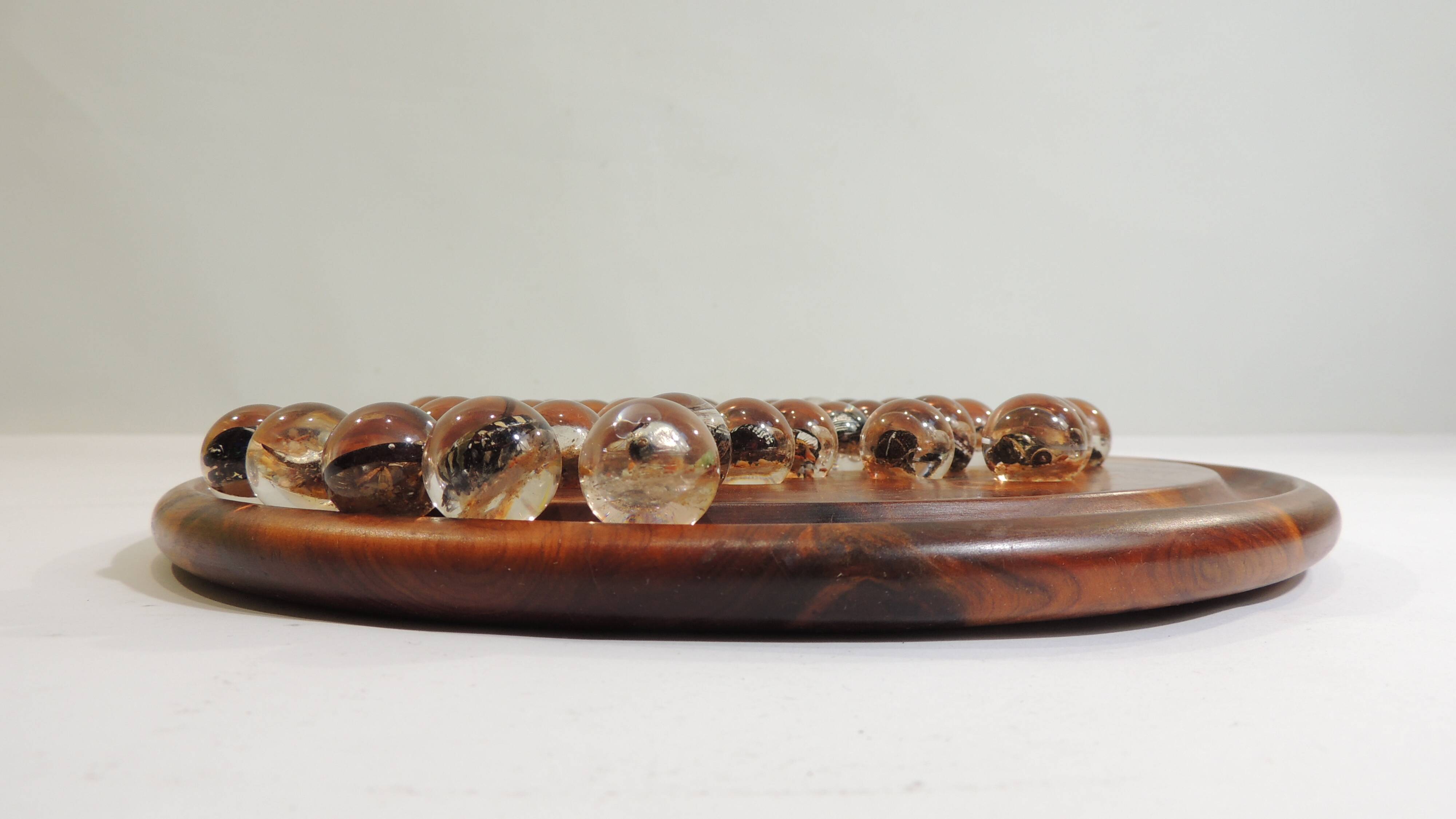Vintage wooden solitaire game with resin balls and insects – Madaga