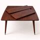 Extendable formica table from the 1960s with a Scandinavian rosewood effect.