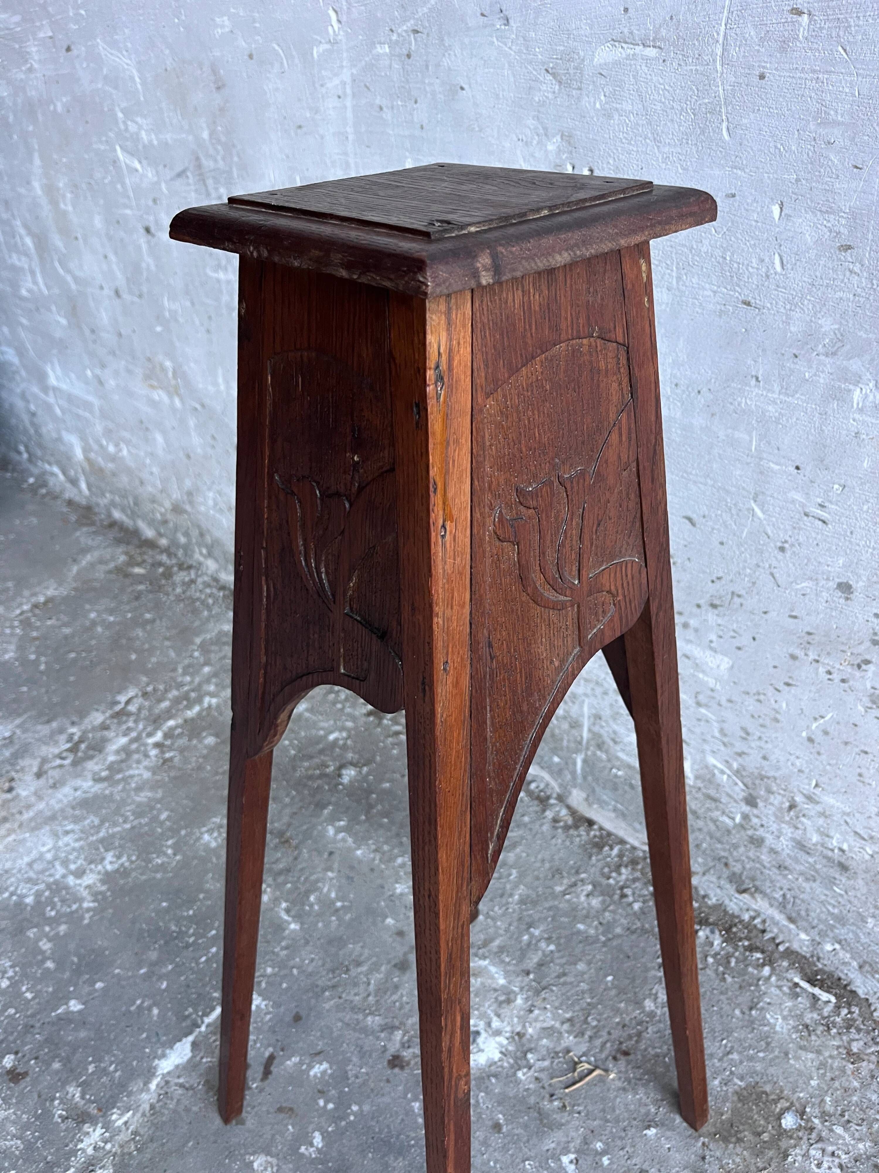 Sculpted wooden plant stand in Art Nouveau style, circa 1910.