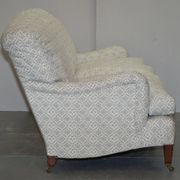 Howard & Sons canapé with feather cushions and ticking fabric, Victorian style.