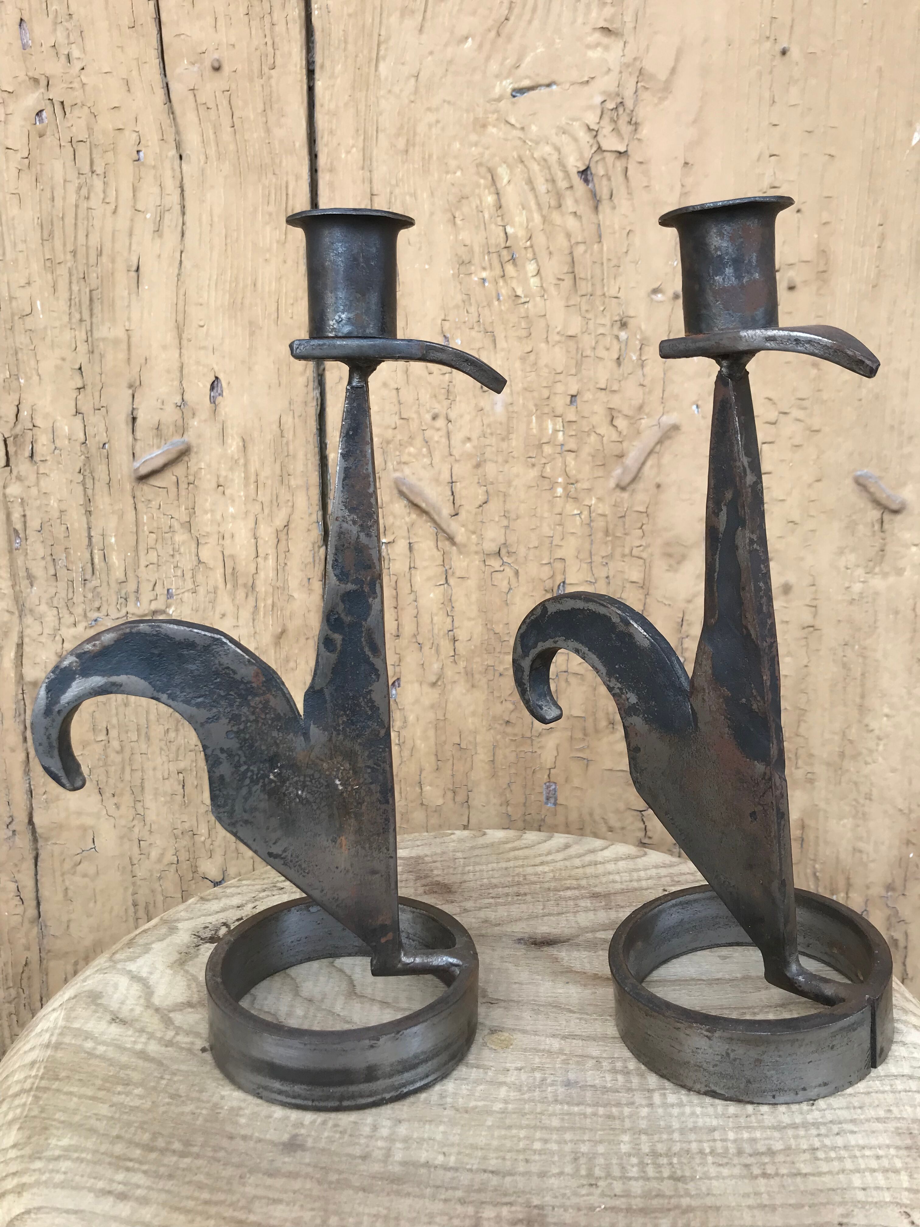 Signed zoomorphic iron candle holders