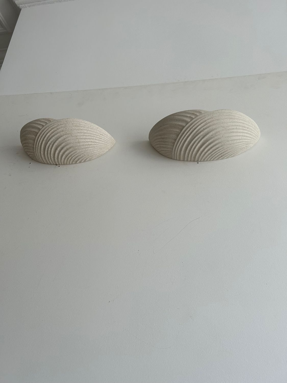Pair of wall lamps in molded plaster France 1980