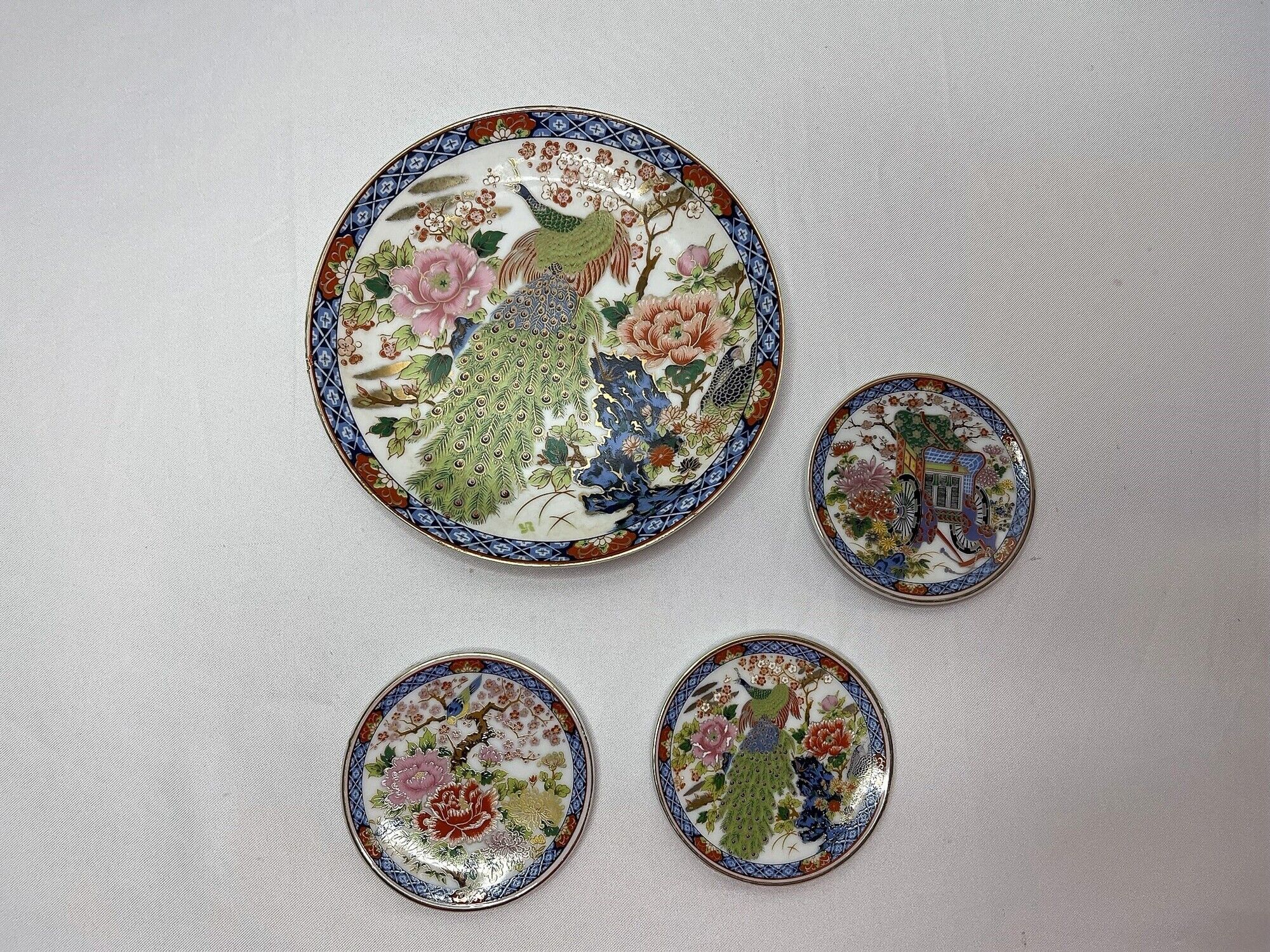 Set of 4 porcelain plates decoration peacock Japan XXth