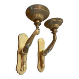 Pair of bronze wall sconces with outstretched arms and hands