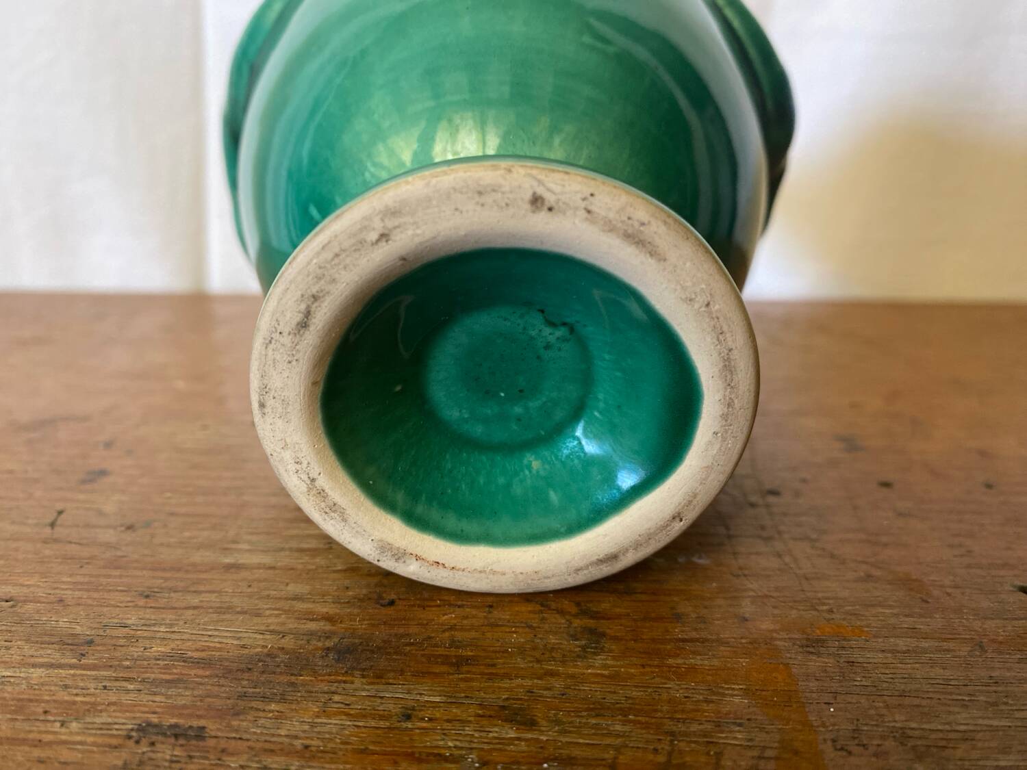Antique green ceramic vase with handles