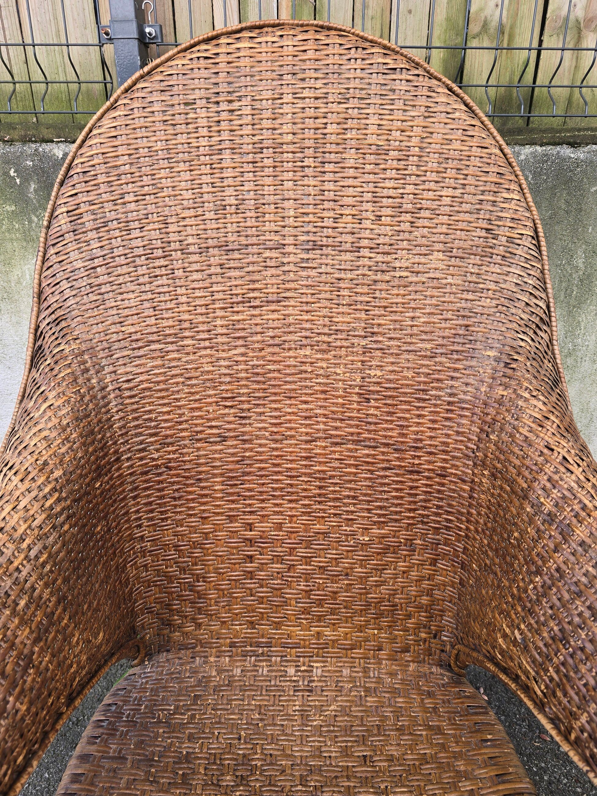 Arts & Crafts armchair in wicker and rattan attributed to Dryad & Co, UK, circa 1920.