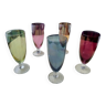 5 glass flutes of different colors