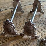 Series of 12 monogrammed silver metal knife holders