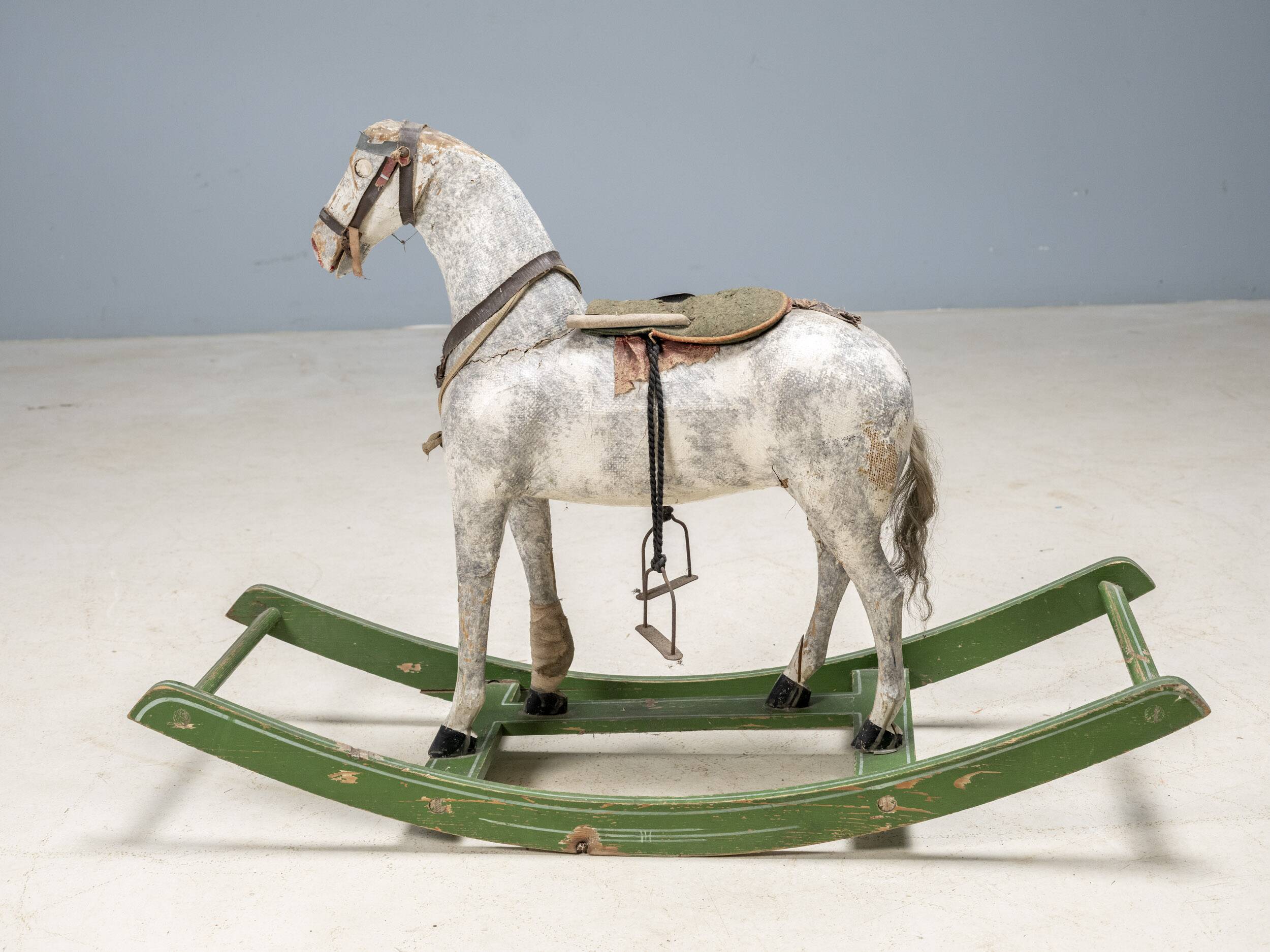 Antique wooden rocking horse, vintage toy with original patina.