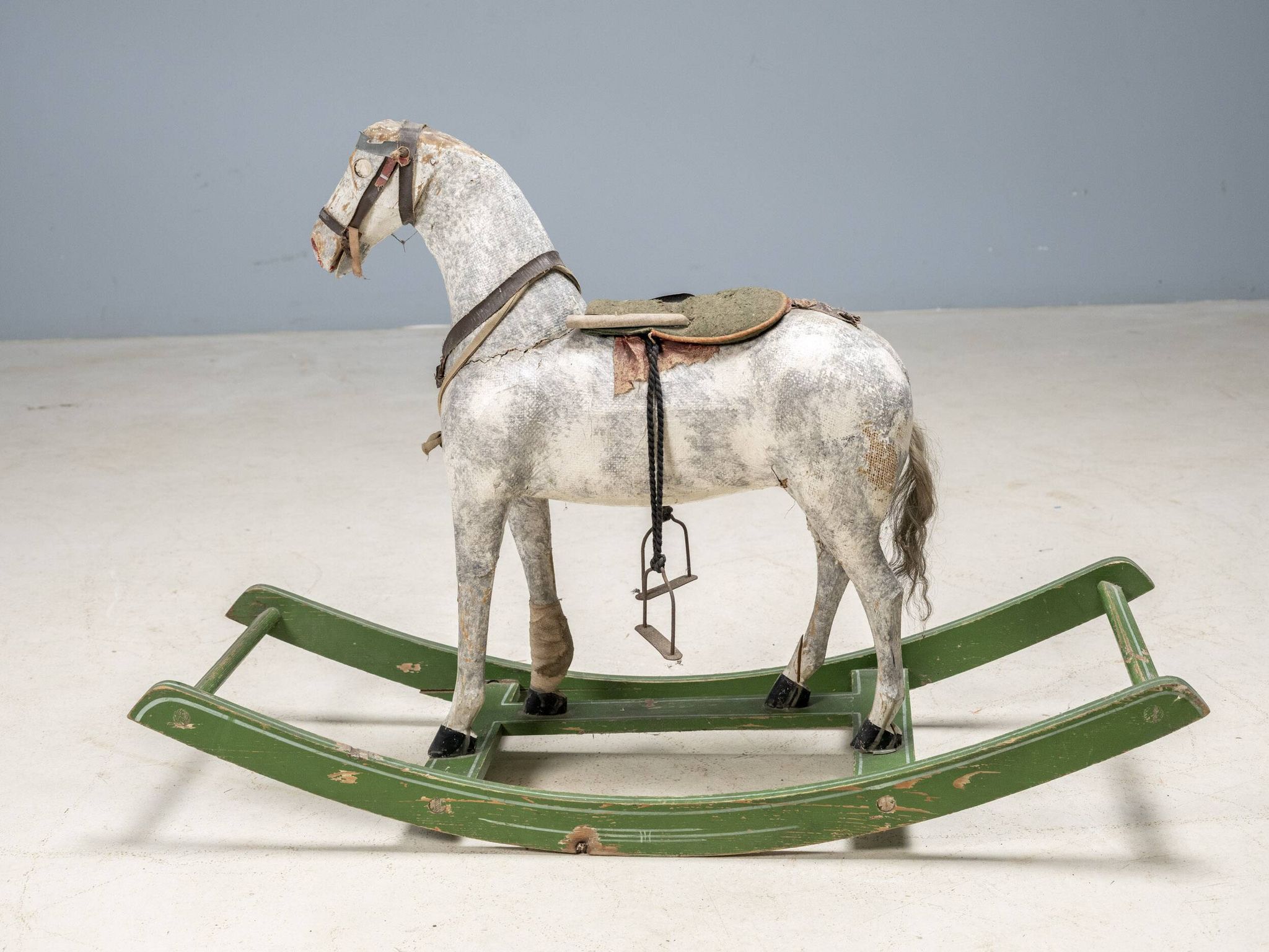 Antique wooden rocking horse, vintage toy with original patina.