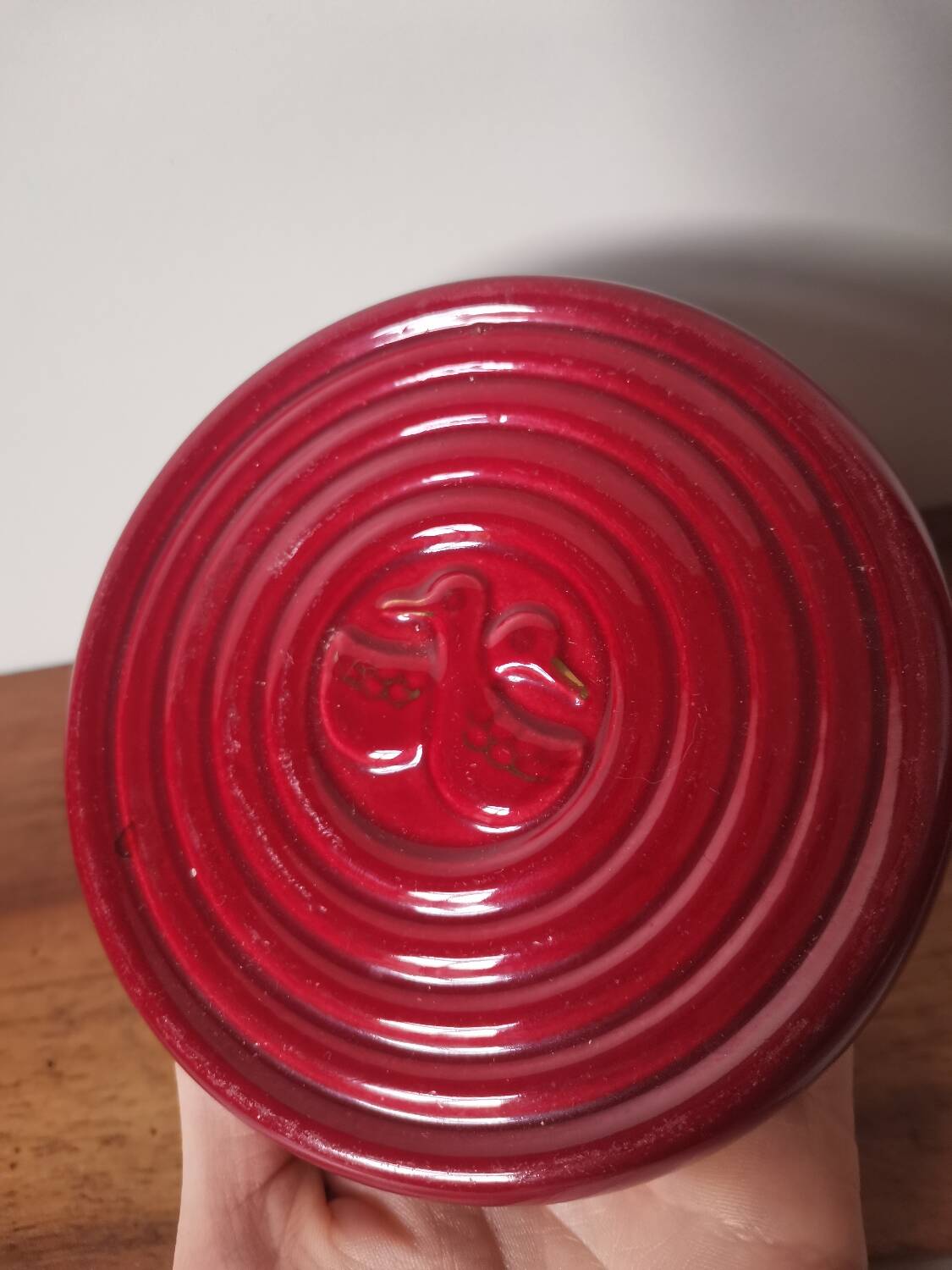 Vintage burgundy red slip ceramic coaster with duck pattern