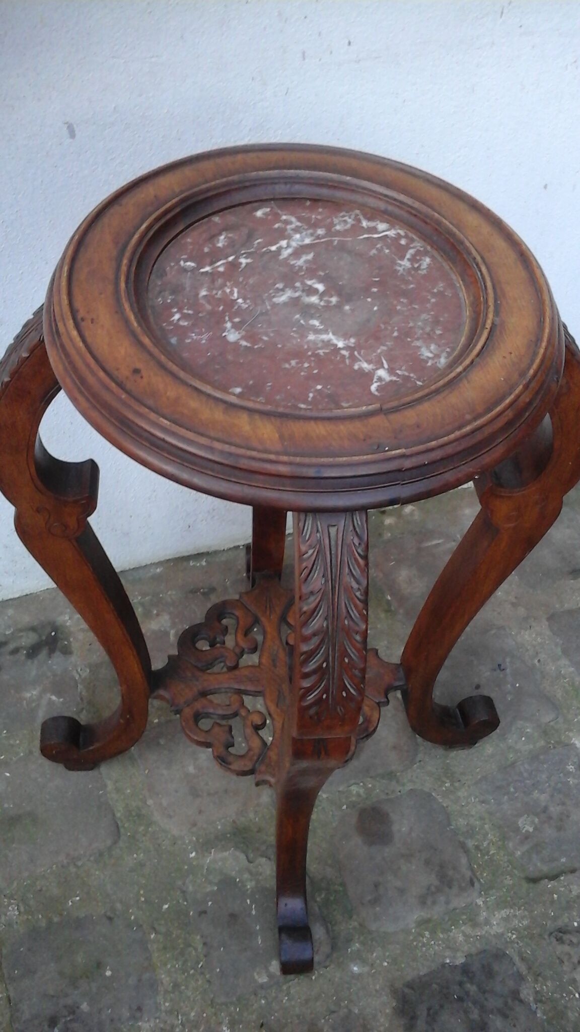 Wooden pedestal table with marble top