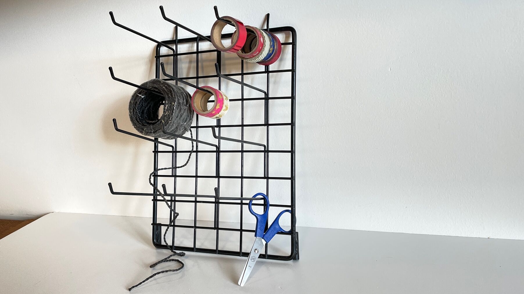 Vintage black metal wall loom display