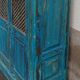 Old wooden cabinet with doors with grille