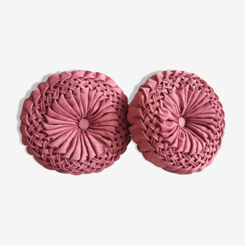 Pair of round pink pleated satin cushions