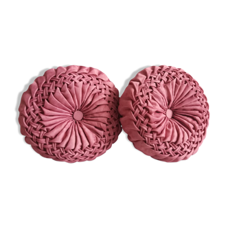 Pair of round pink pleated satin cushions