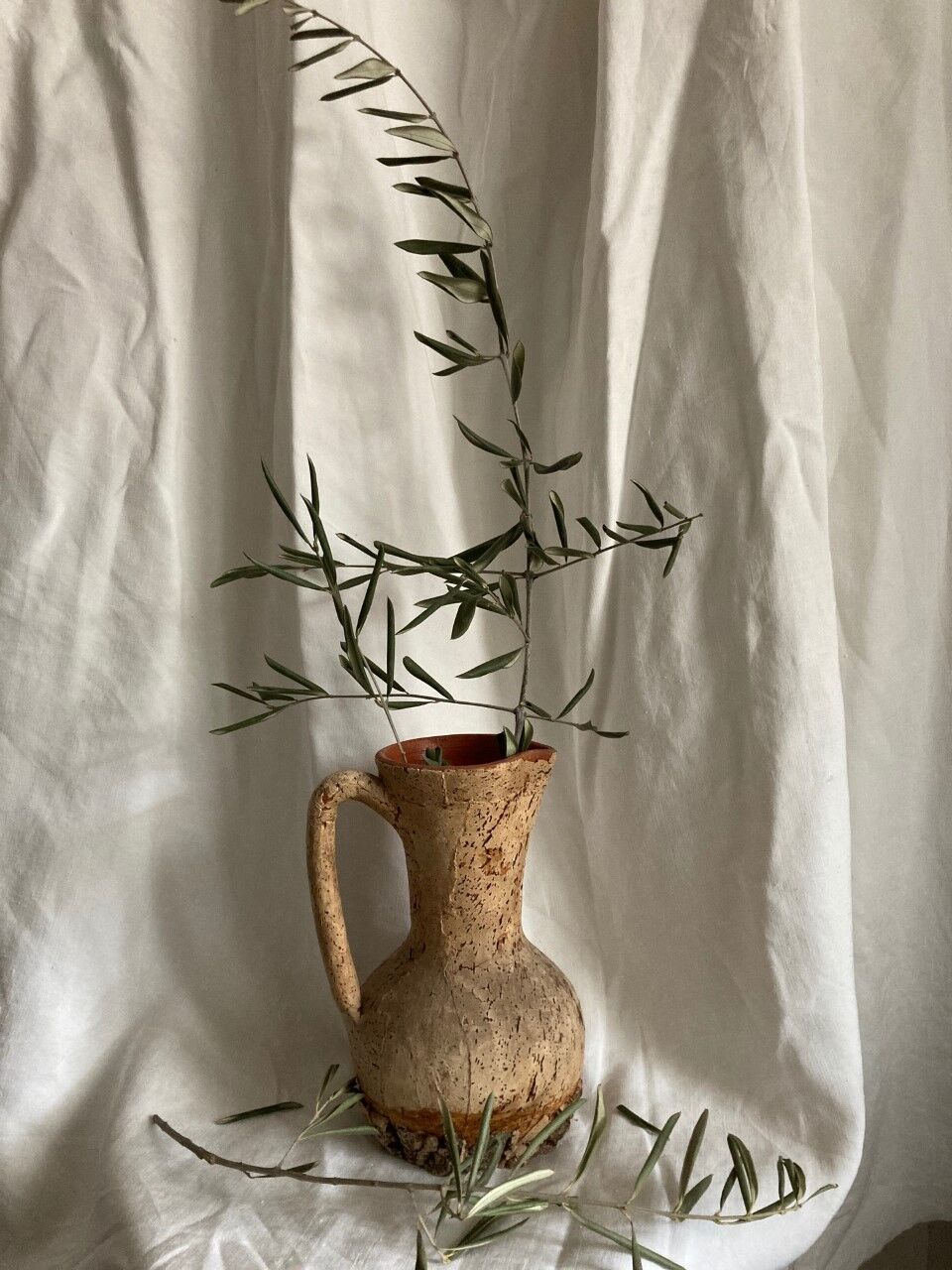 Terracotta jug covered with cork