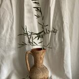 Terracotta jug covered with cork