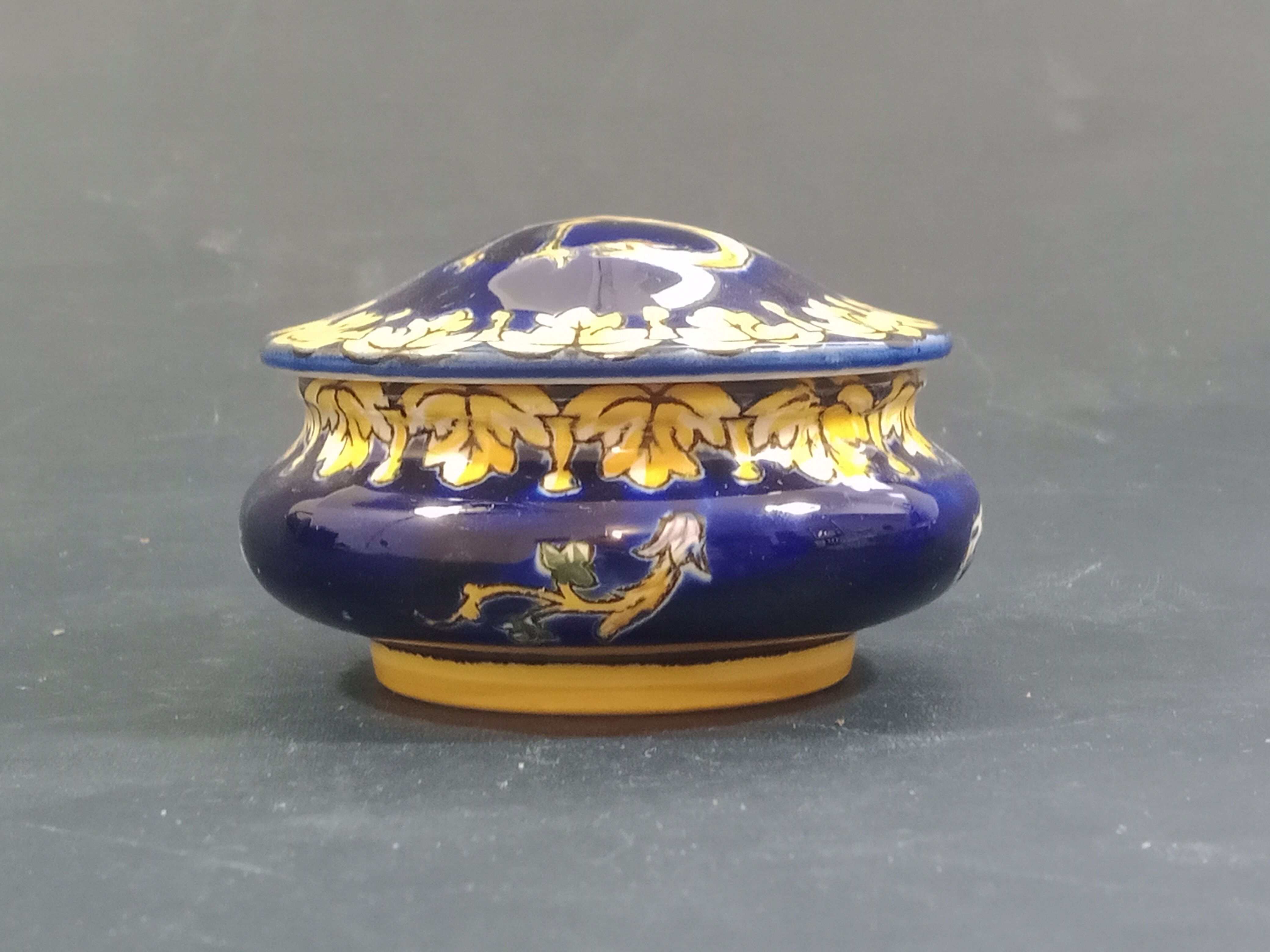 Empty Gien earthenware pocket decorated with chimera decoration