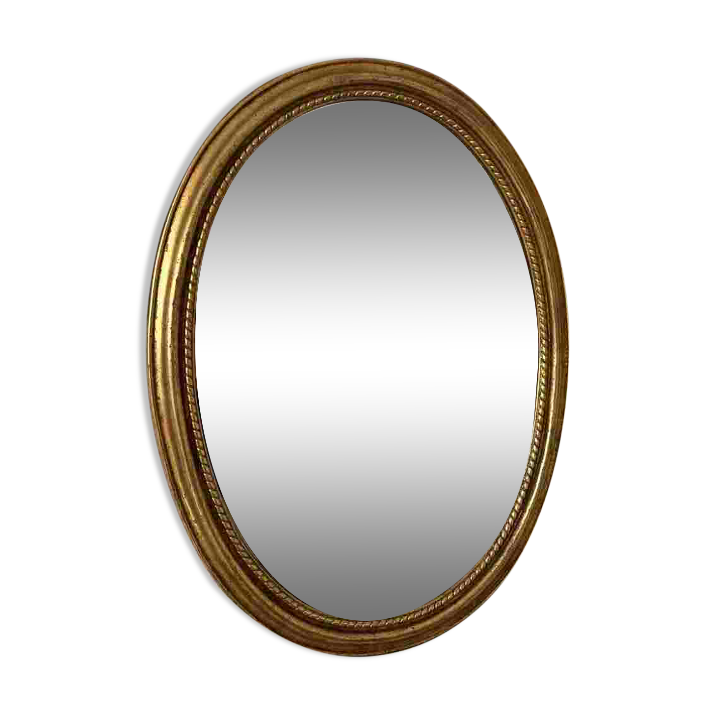 Oval mirror in antique gilded wood