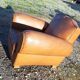 Fauteuil club des années 30 en simili cuir