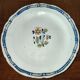 Old earthenware plate of the North XVIIIth Century with floral decoration