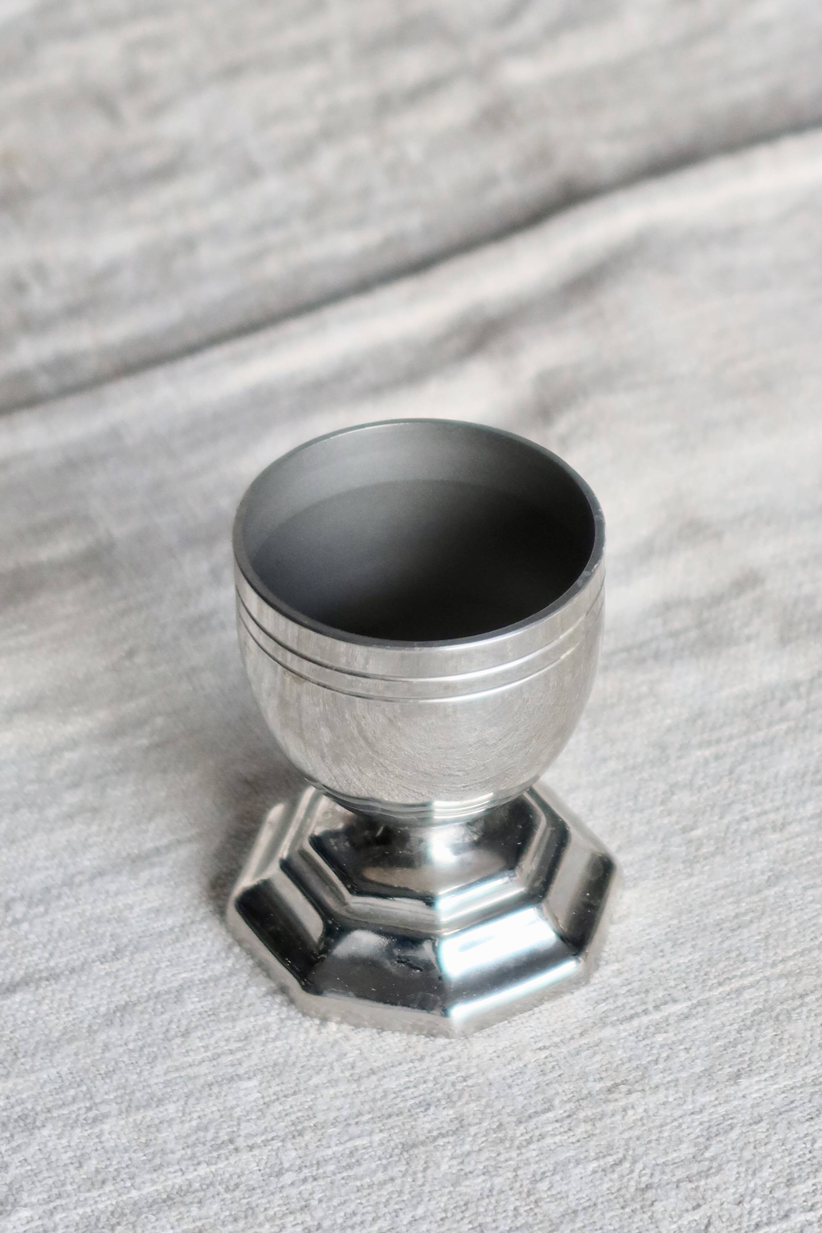 Vintage silver-plated egg cup with an octagonal base.