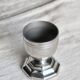 Vintage silver-plated egg cup with an octagonal base.