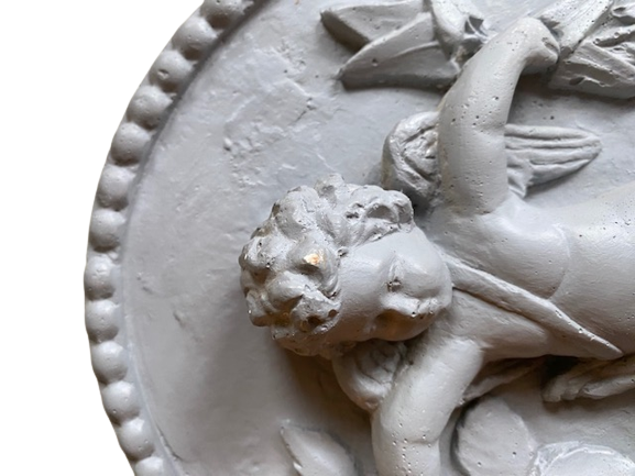 Plaster medallion cherub and garland of flowers patinated gray