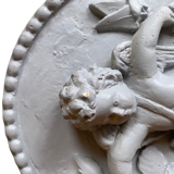 Plaster medallion cherub and garland of flowers patinated gray
