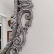 Louis XVI style patinated oval mirror