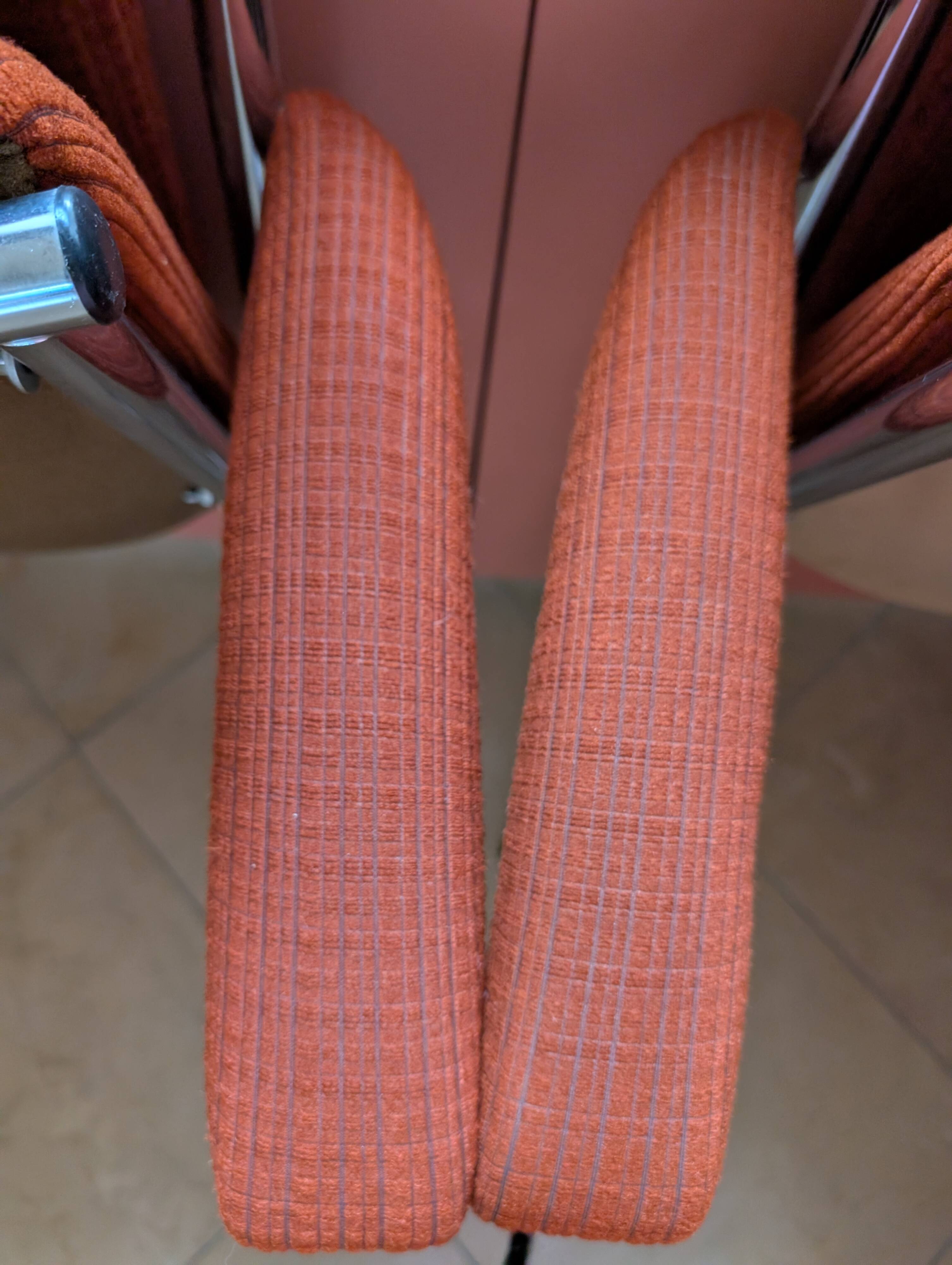 Pair of vintage folding chairs in terracotta fabric.