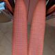 Pair of vintage folding chairs in terracotta fabric.