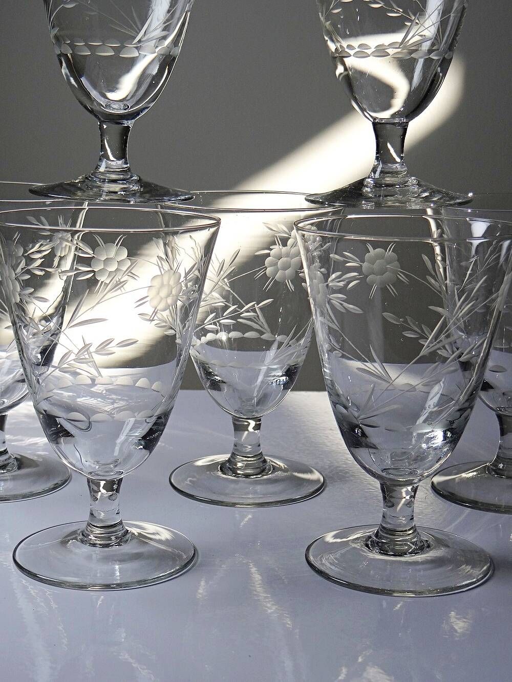 8 engraved crystal wine glasses with a floral design, Bohemia, early 20th century.