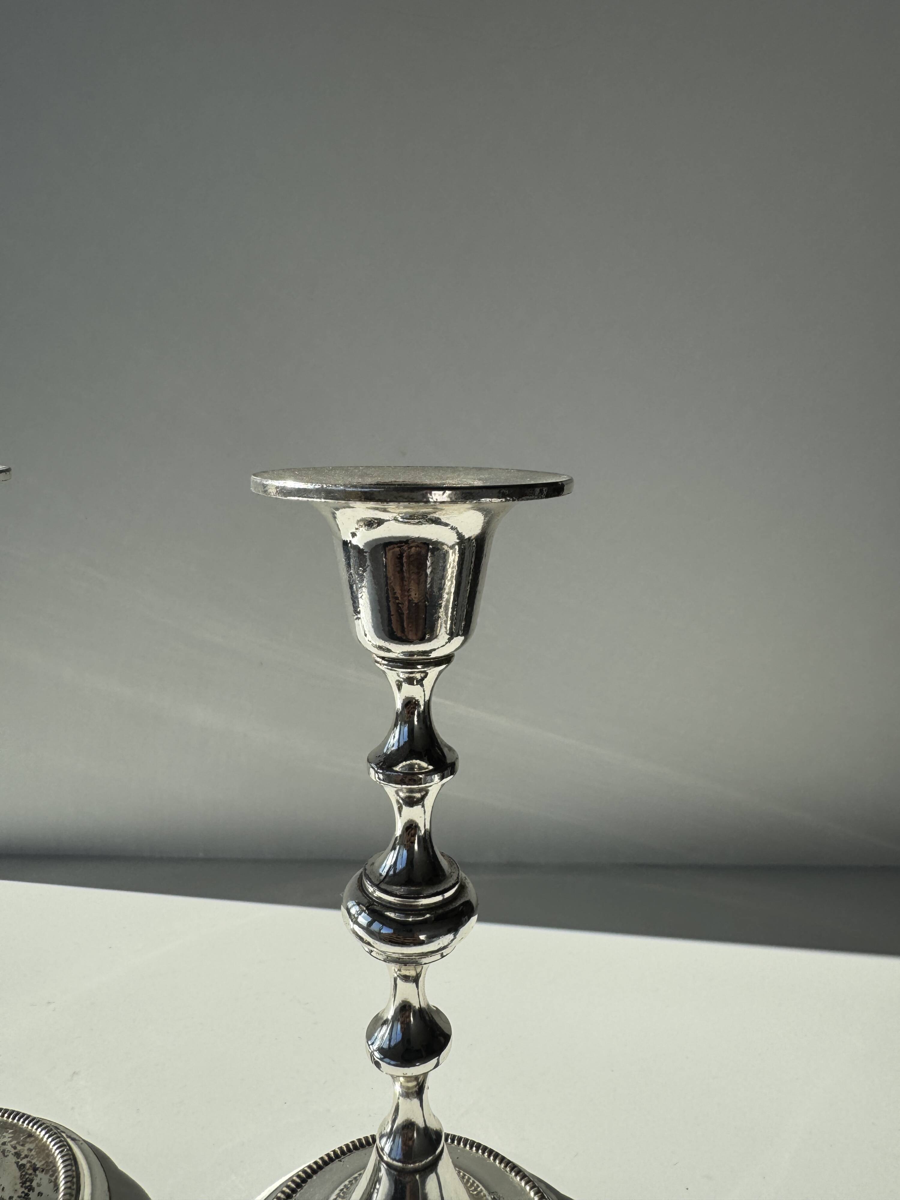 Pair of small silver candlesticks