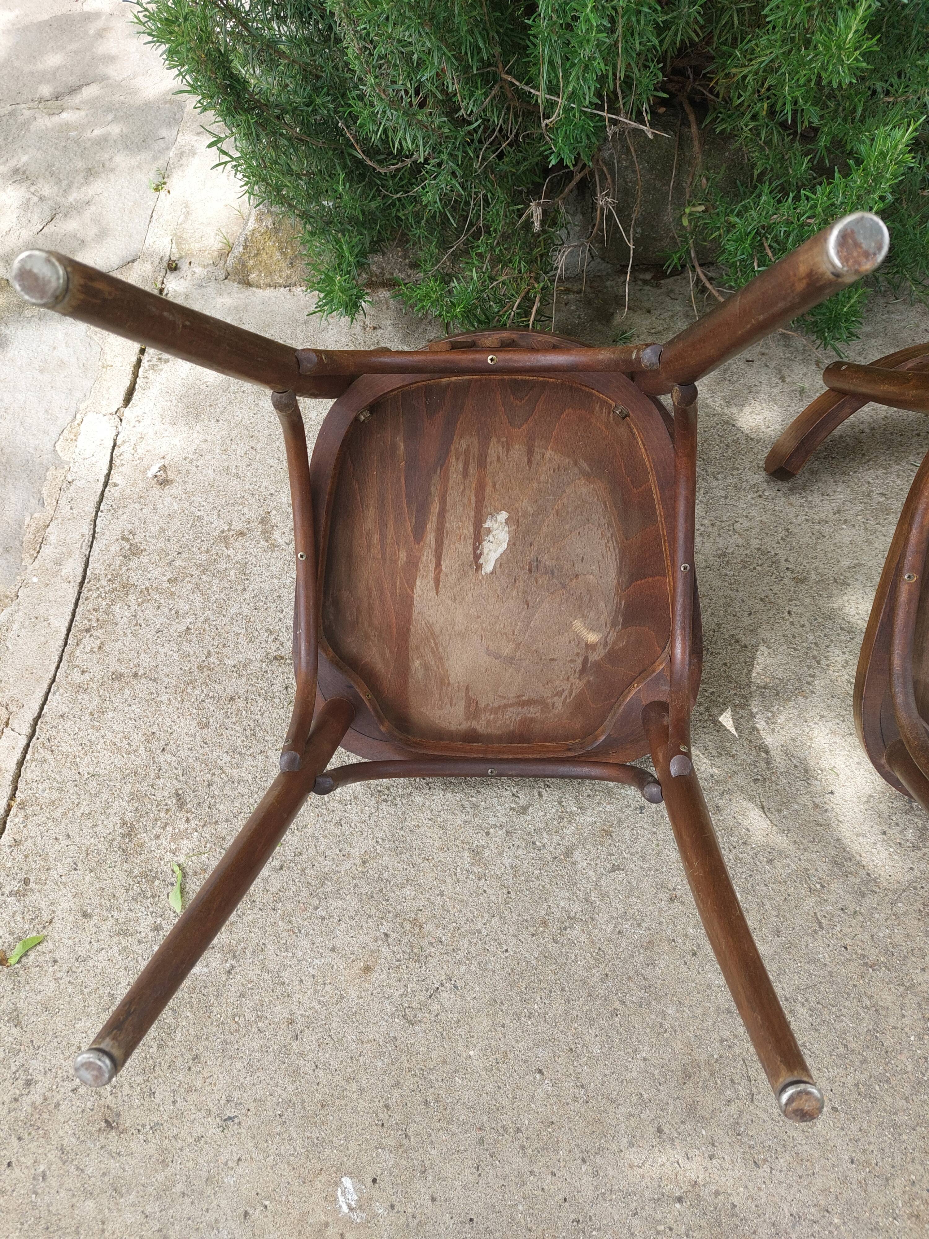 pair of dark bistro chairs, rounded backs, Baumann style