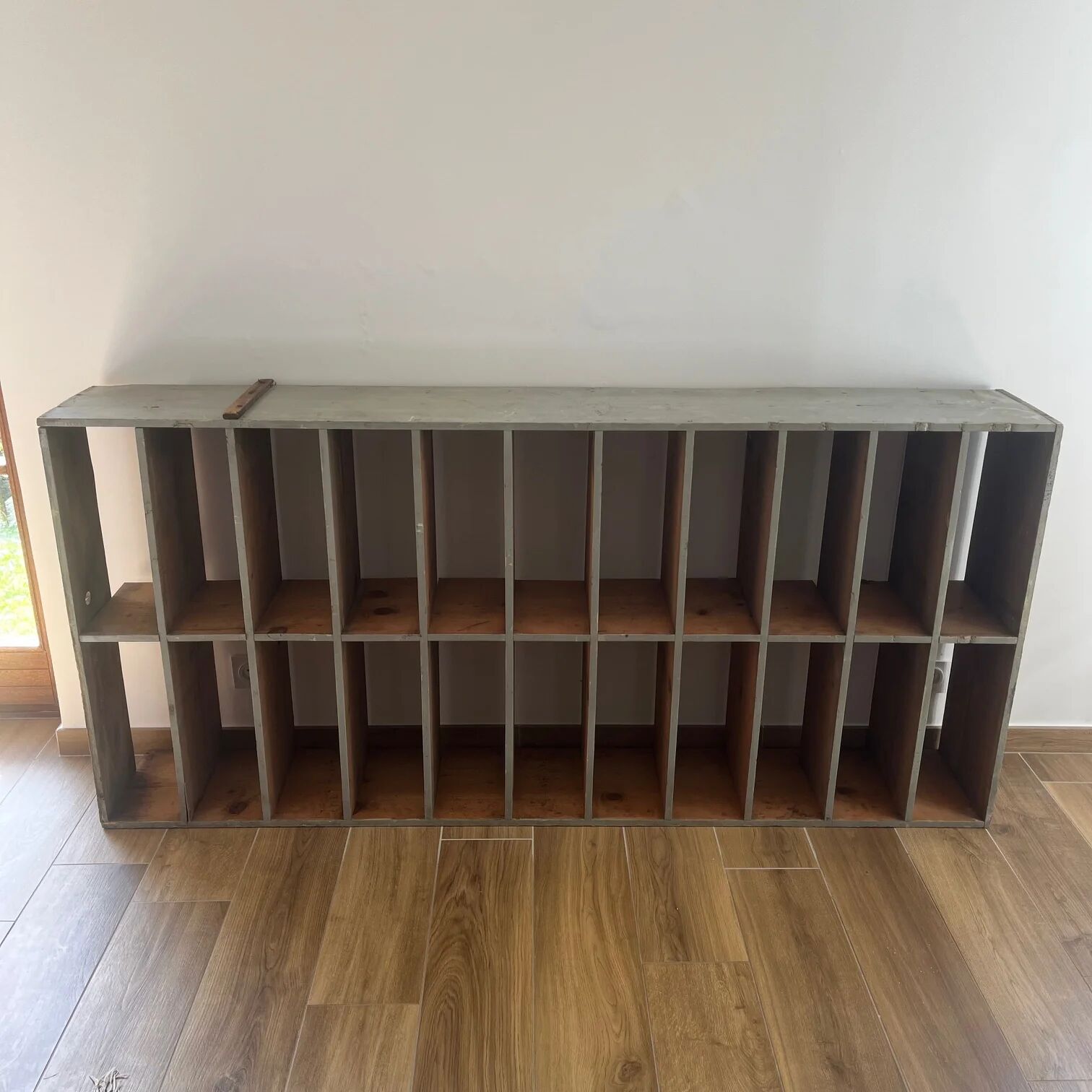 Large antique workshop cabinet with patinated wooden compartments, 20th century.