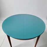 Extendable oval teak dining table