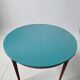 Extendable oval teak dining table