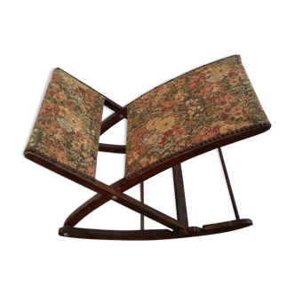 Wooden footrest and vintage tapestry
