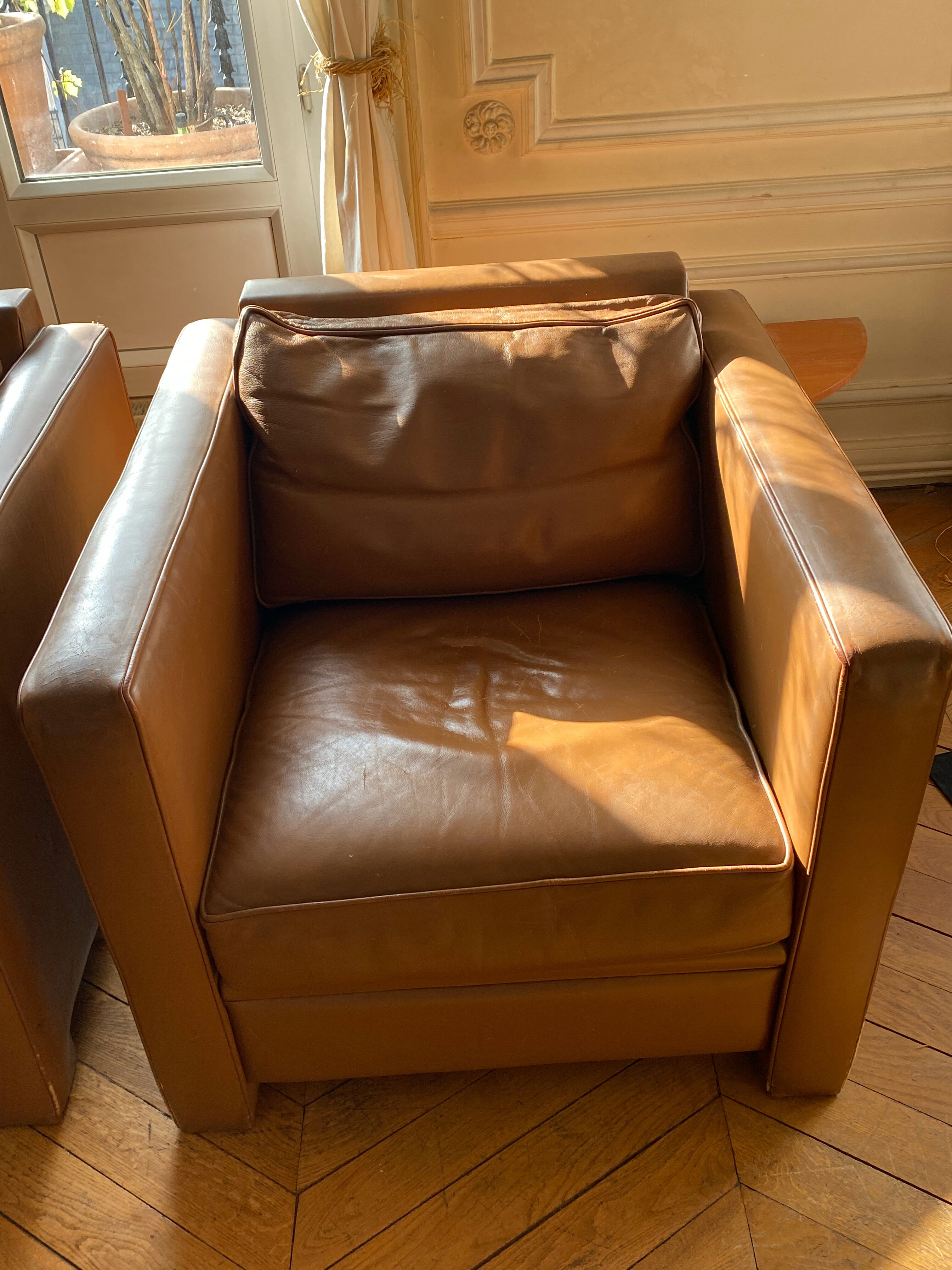 Hugues Chevalier leather armchairs