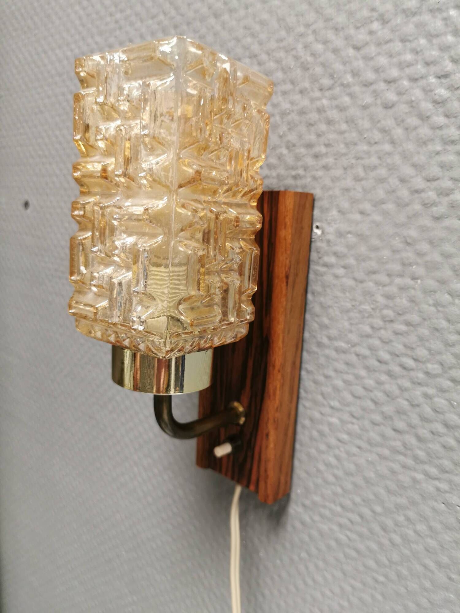 Small, stylish wall lamp with rosewood suspension and hard pressed glass