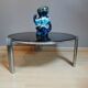 Table basse verre fumé et pieds chromés