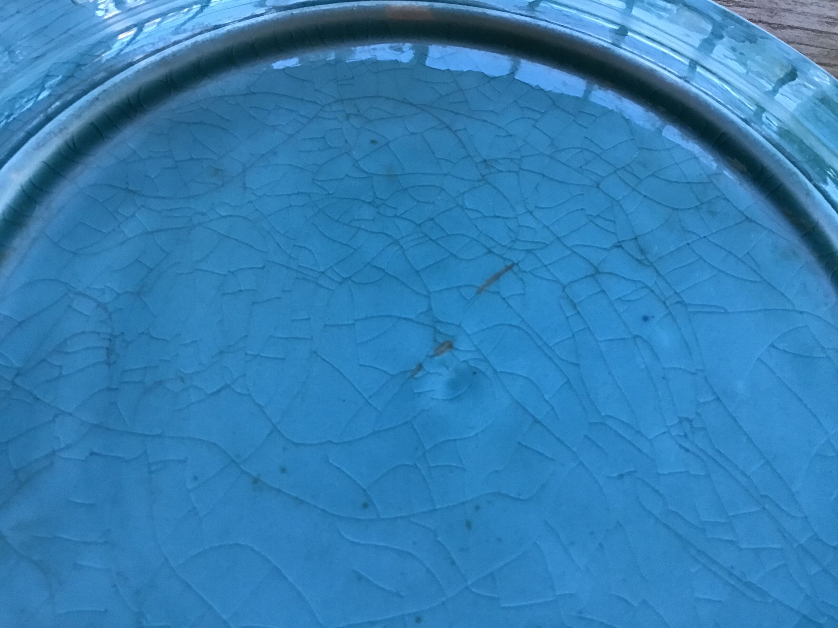 Cracked earthenware plate the Eiffel Tower