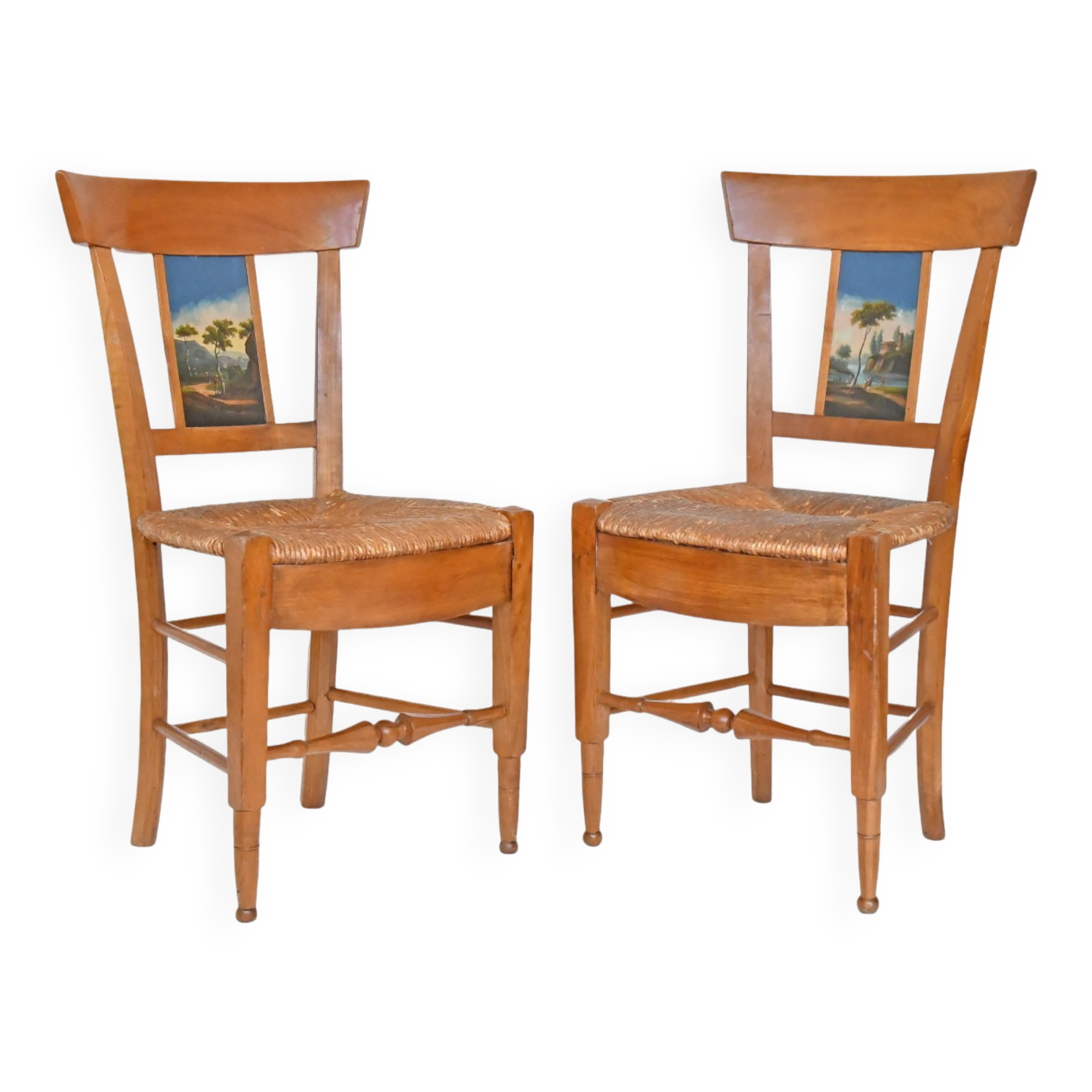 Pair of chairs with barrette backs and bands painted with animated landscapes