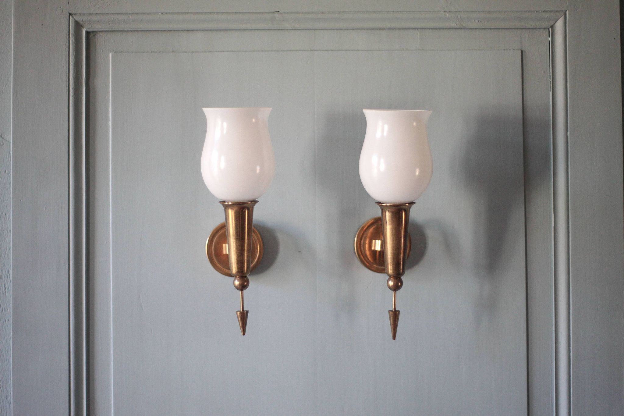 Pair of gold metal and white opaline wall sconces, wall light, sconce.