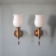 Pair of gold metal and white opaline wall sconces, wall light, sconce.