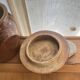 Ancient ceramic salt cellar and its lid.