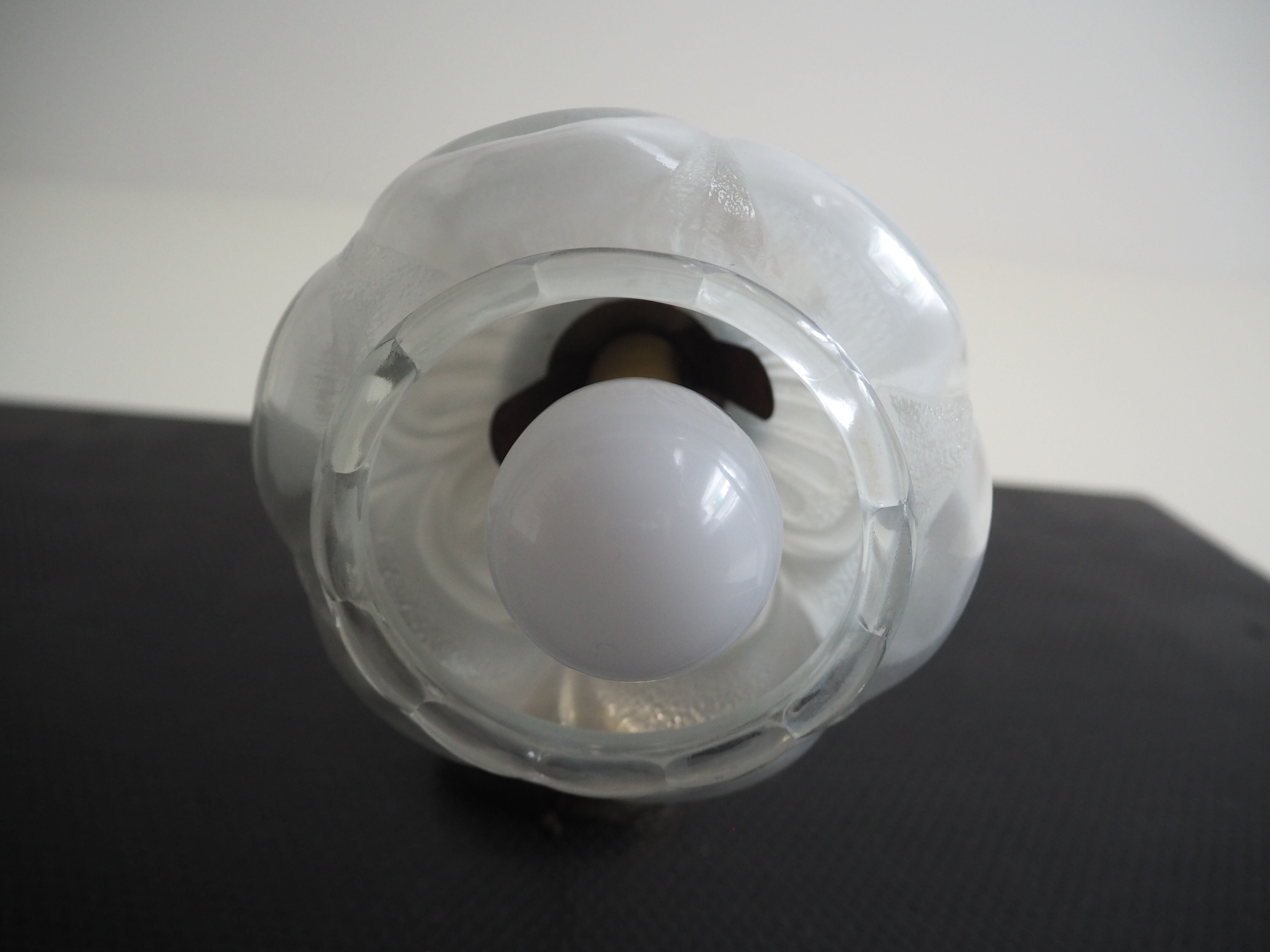Brass wall lamp and white glass globe from the 1950s-1960s.