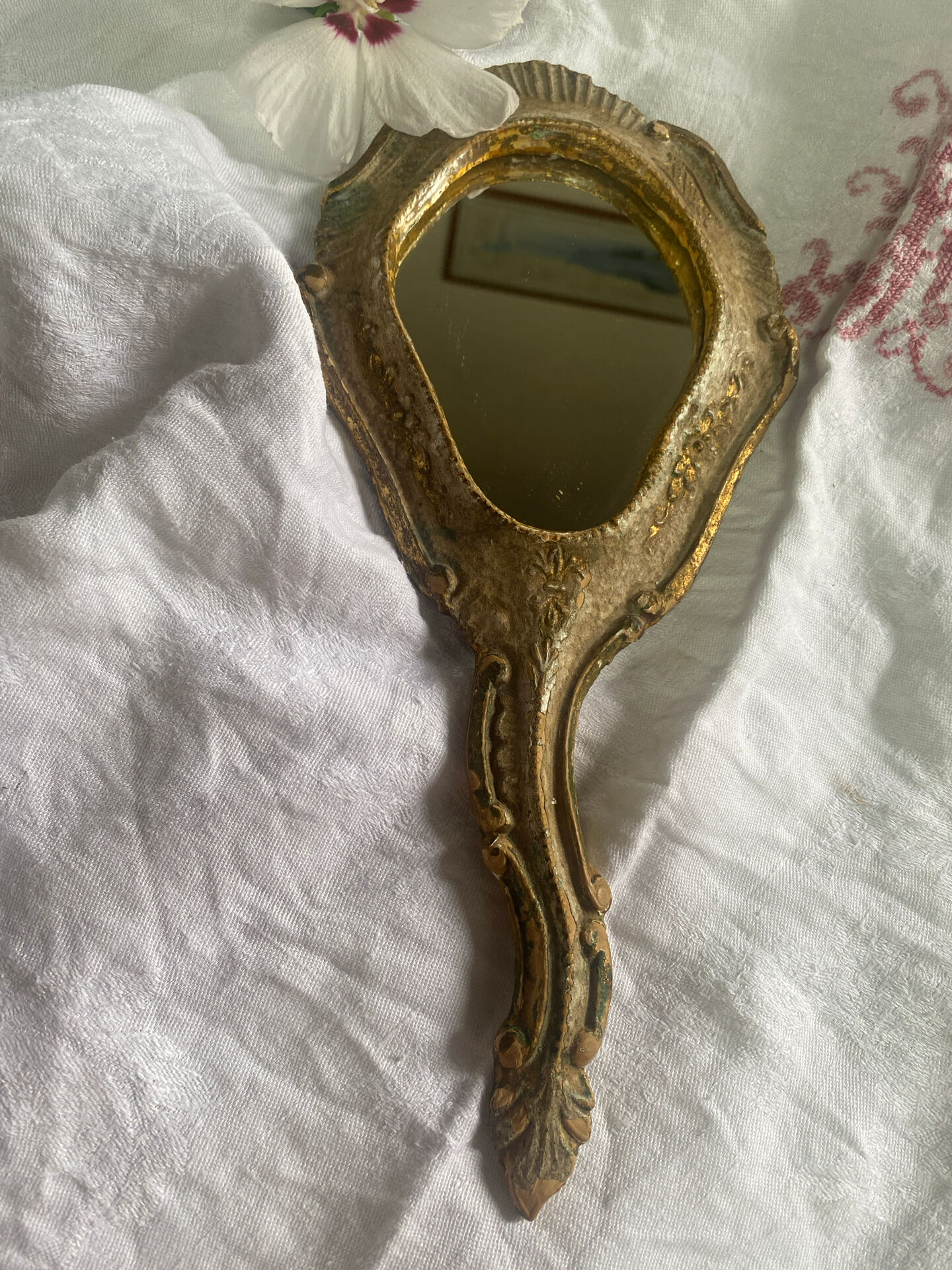 Patinated wooden Florentine hand mirror